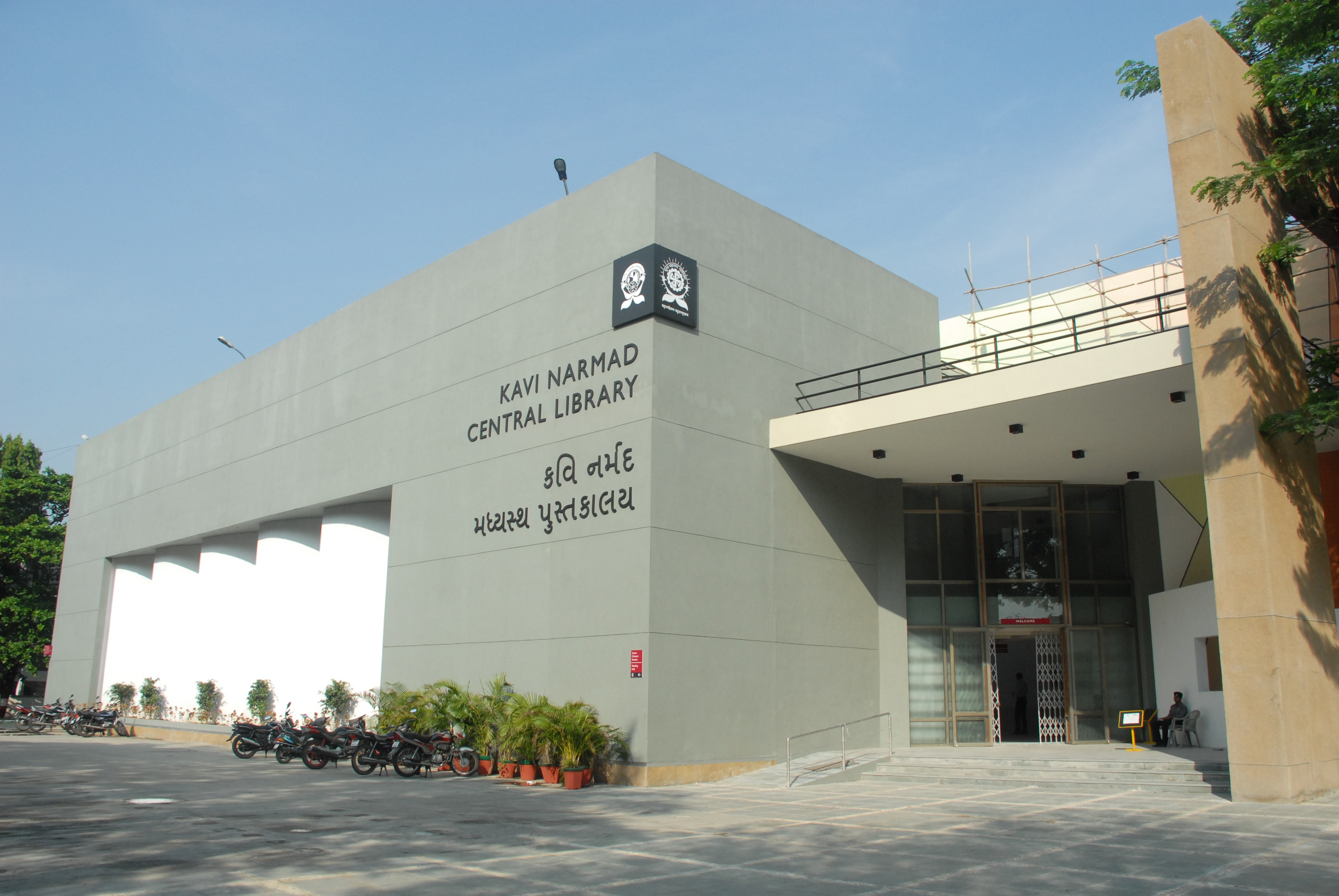 Photo of a man in a room using a tablet computer