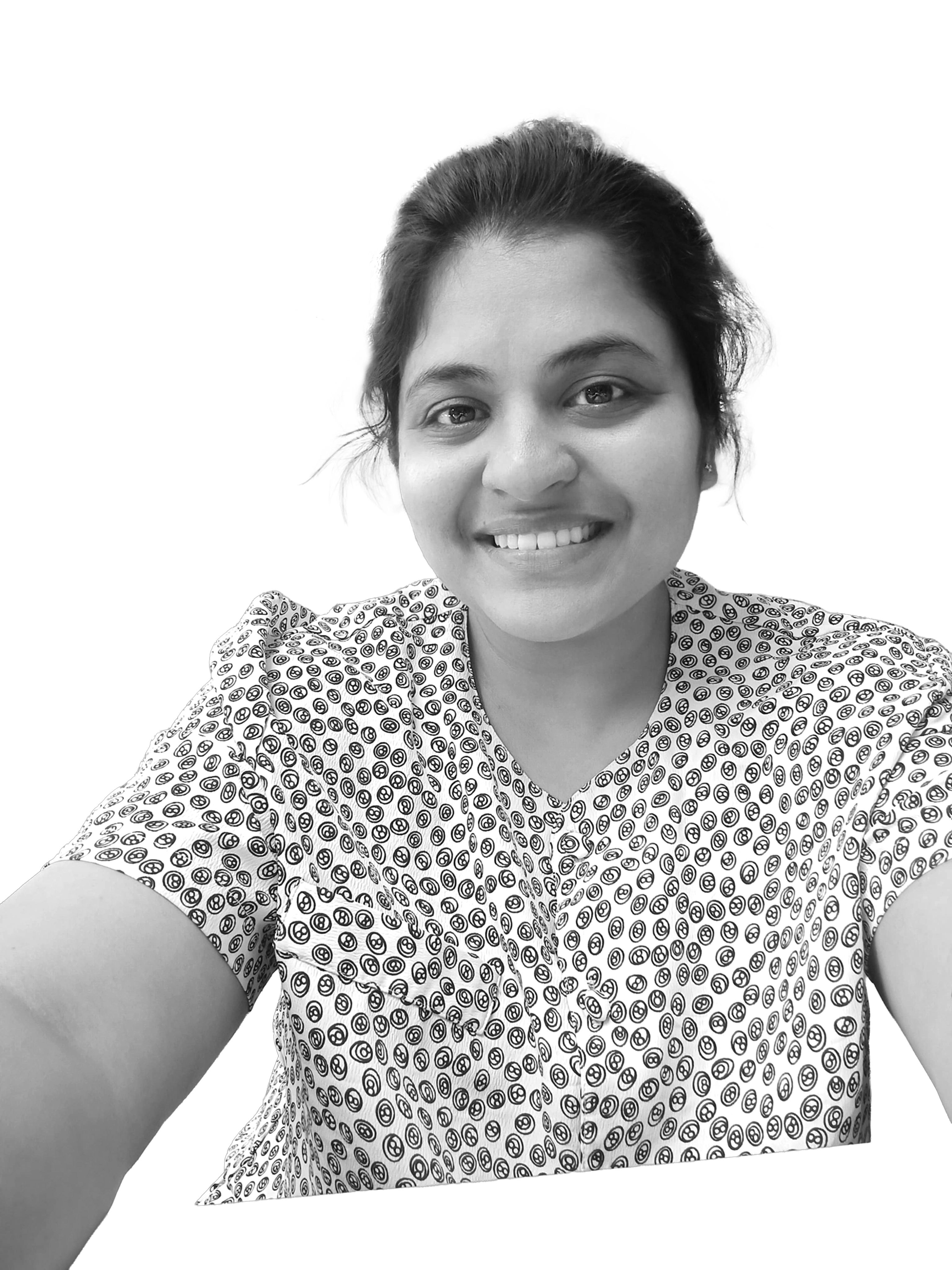 Portrait of a woman with brown hair on a flat gray background.